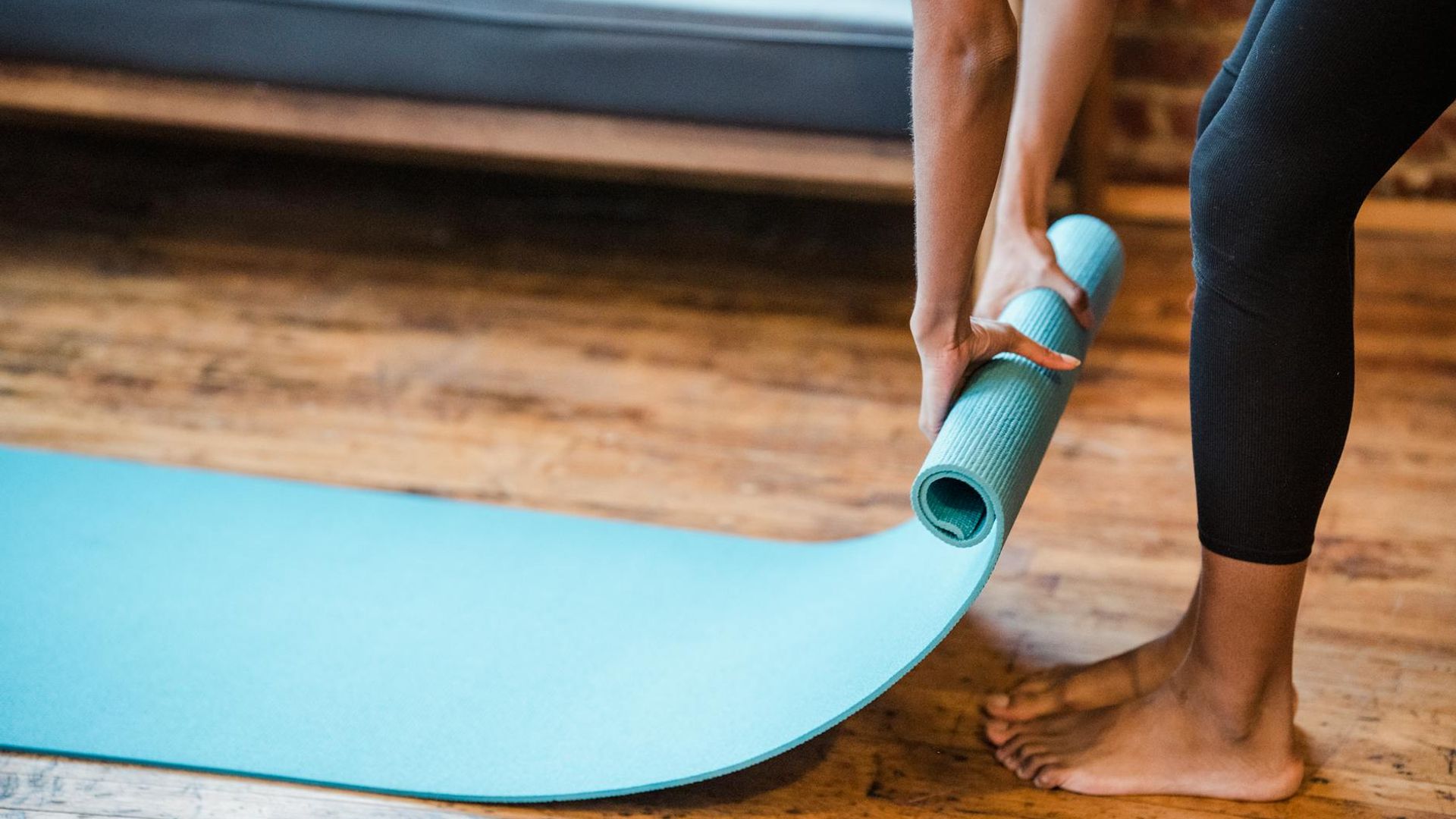 Calm and minimalist space with a yoga mat on the floor.