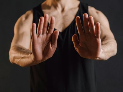 Close-up of hands in a meditation mudra gesture.